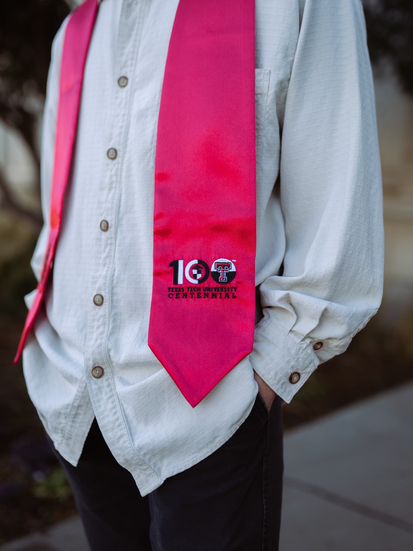 Close detail of an embroidered university centennial graduation stole
